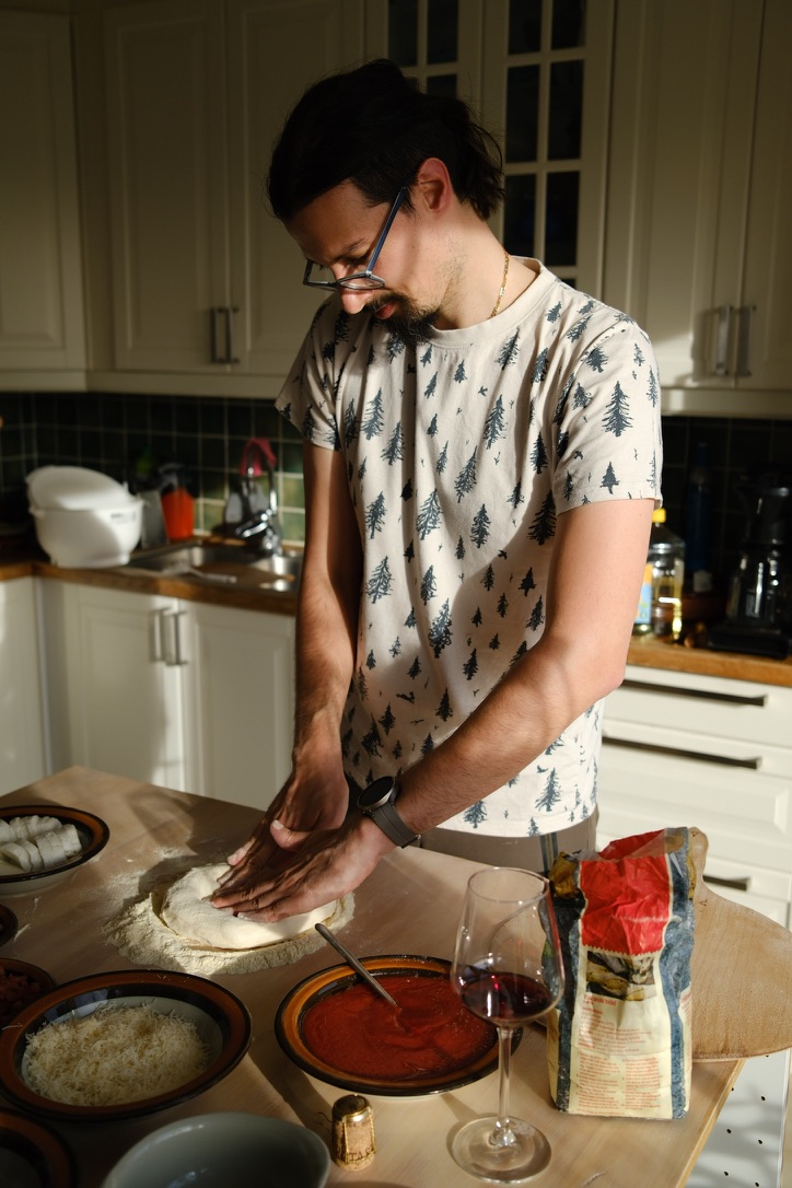 Stretching pizza dough by hand